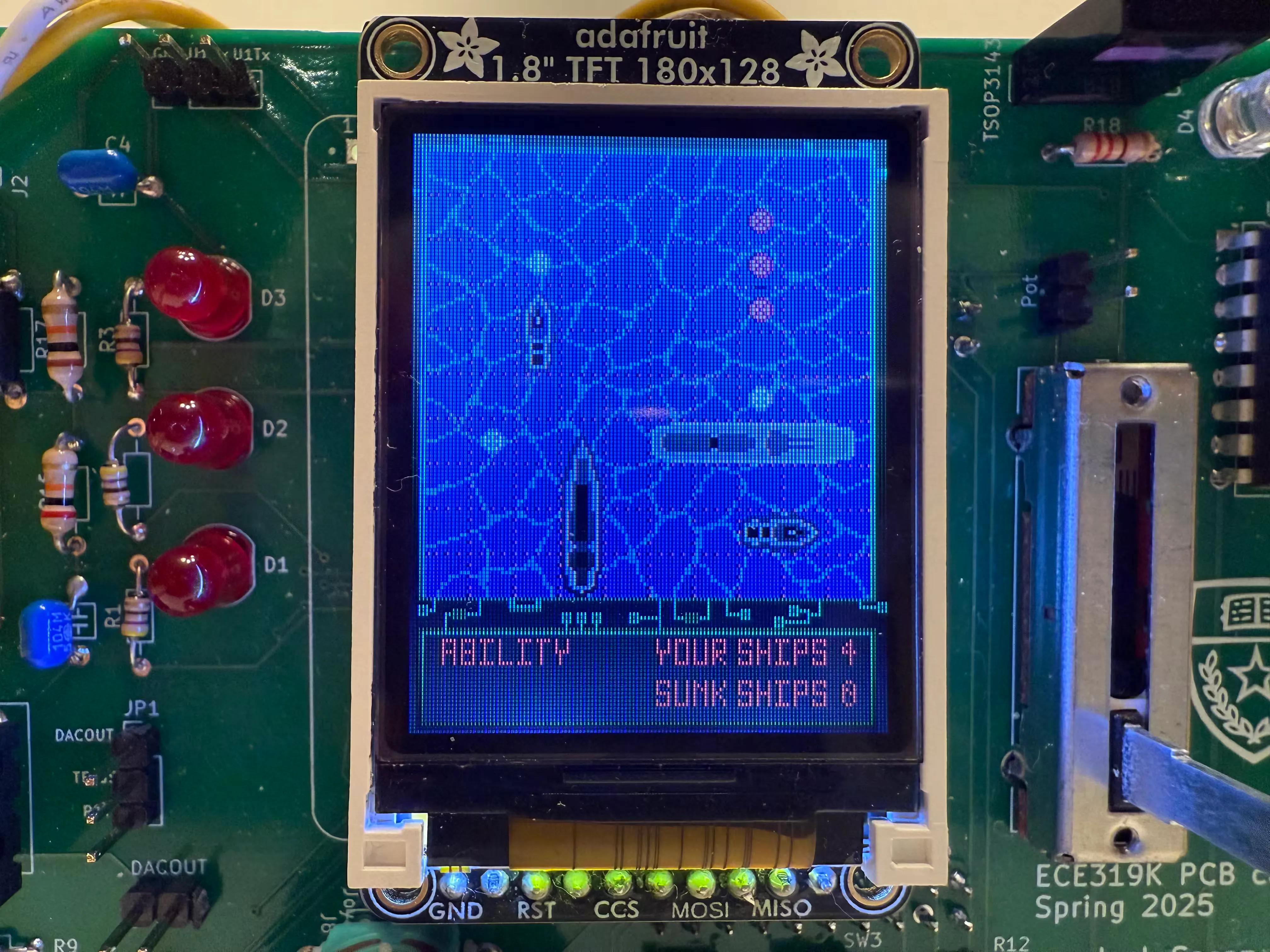 Battleship project PCB, showing the screen with a battleship board showing ships.
